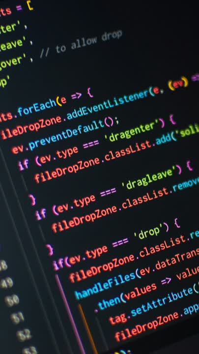 Lines of JavaScript code on a laptop.